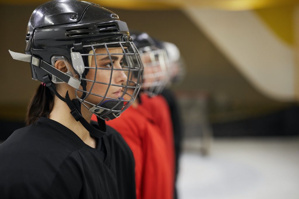 Female Hockey Team in Row