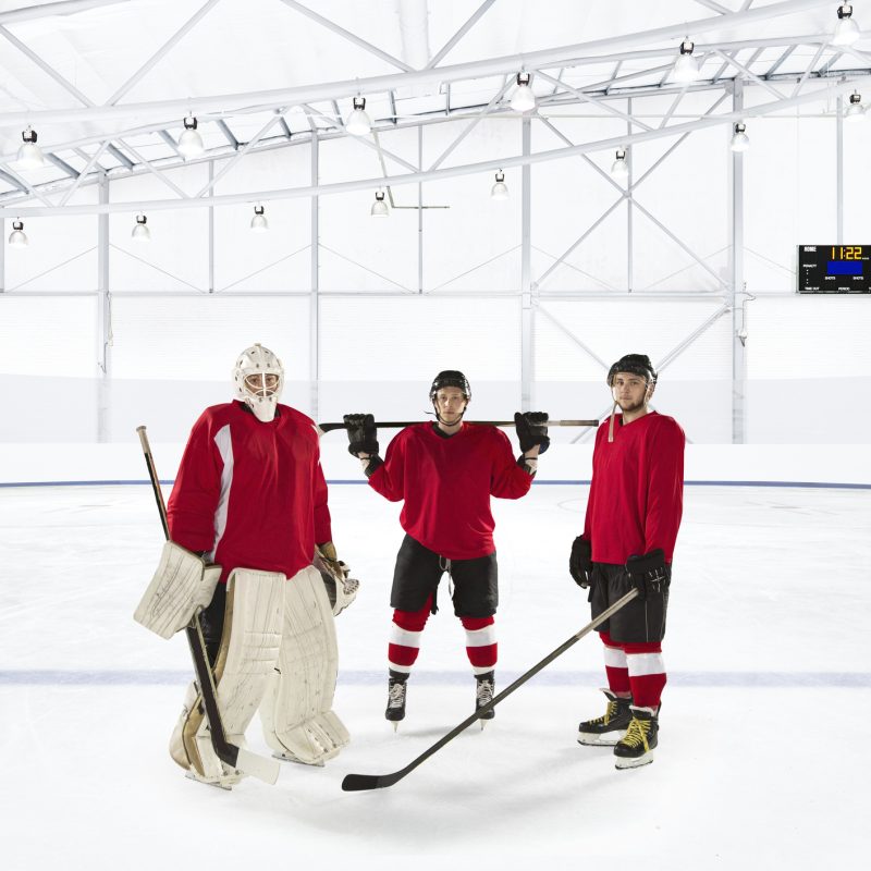 Portrait of ice hockey players wearing red uniforms