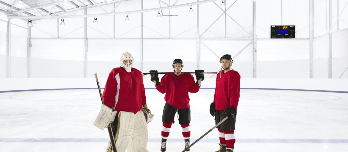 Portrait of ice hockey players wearing red uniforms