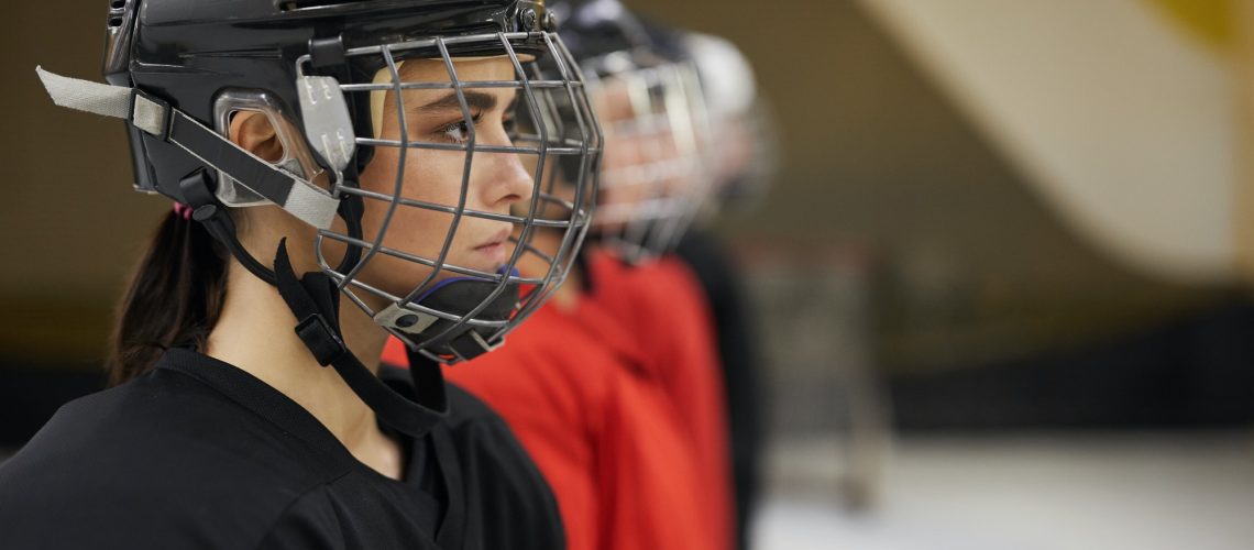 Female Hockey Team in Row
